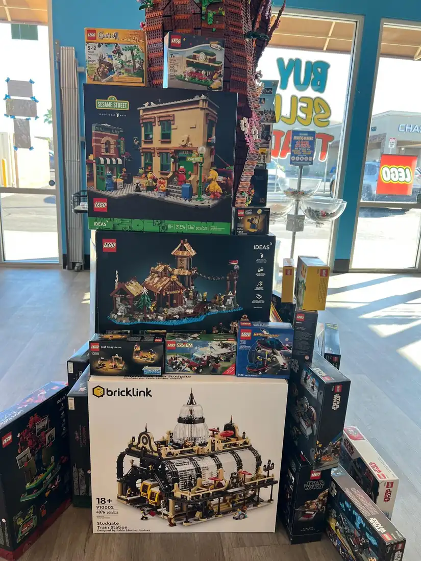 Boxed LEGO® castle and building sets displayed near the store entrance.