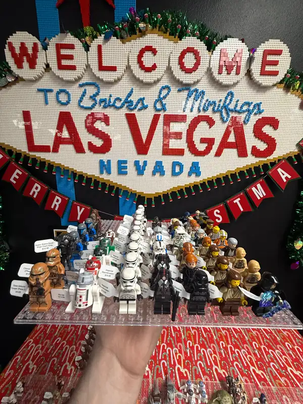 An assortment of LEGO® minifigures on a display board beneath the Las Vegas store sign.