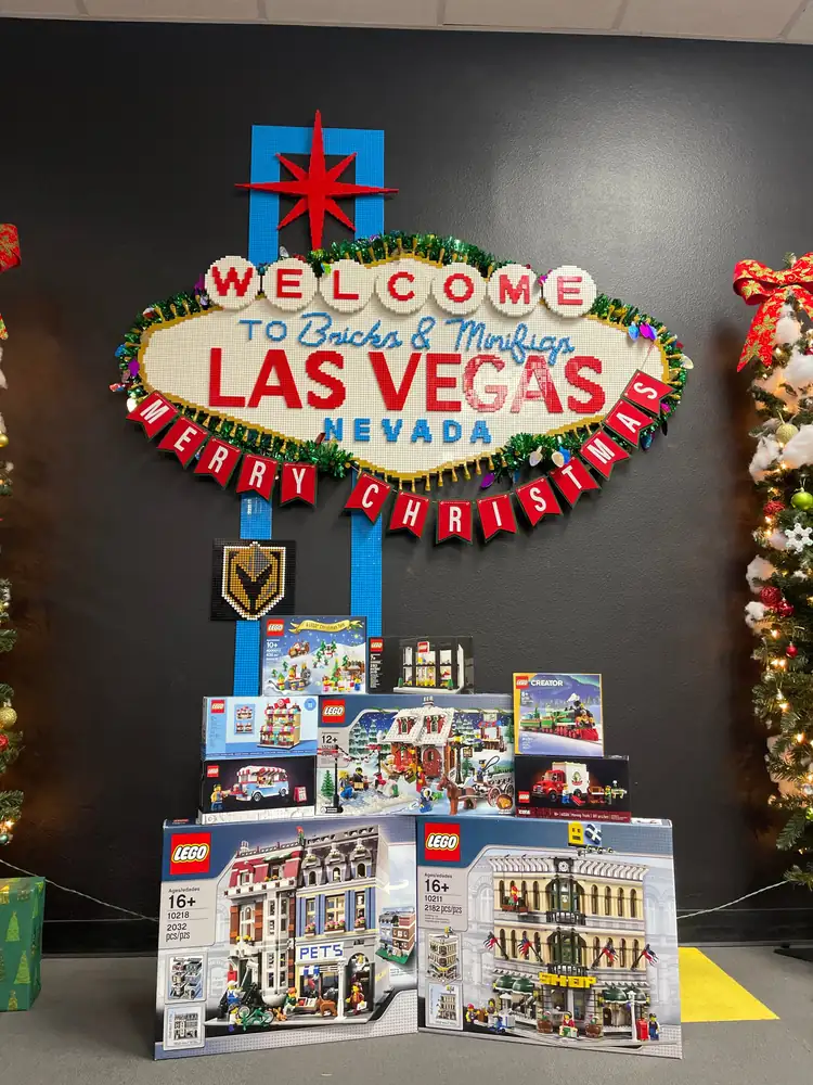 Boxed LEGO® building sets stacked below the Las Vegas store sign.