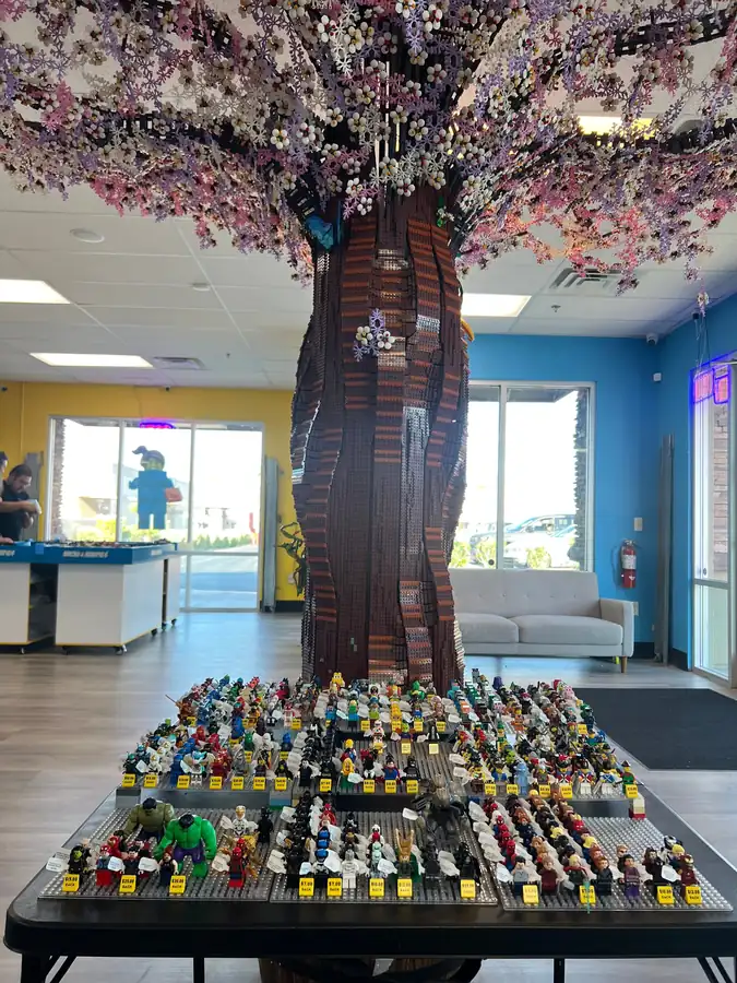A wider view of the minifigure display table prepared for the anniversary weekend.