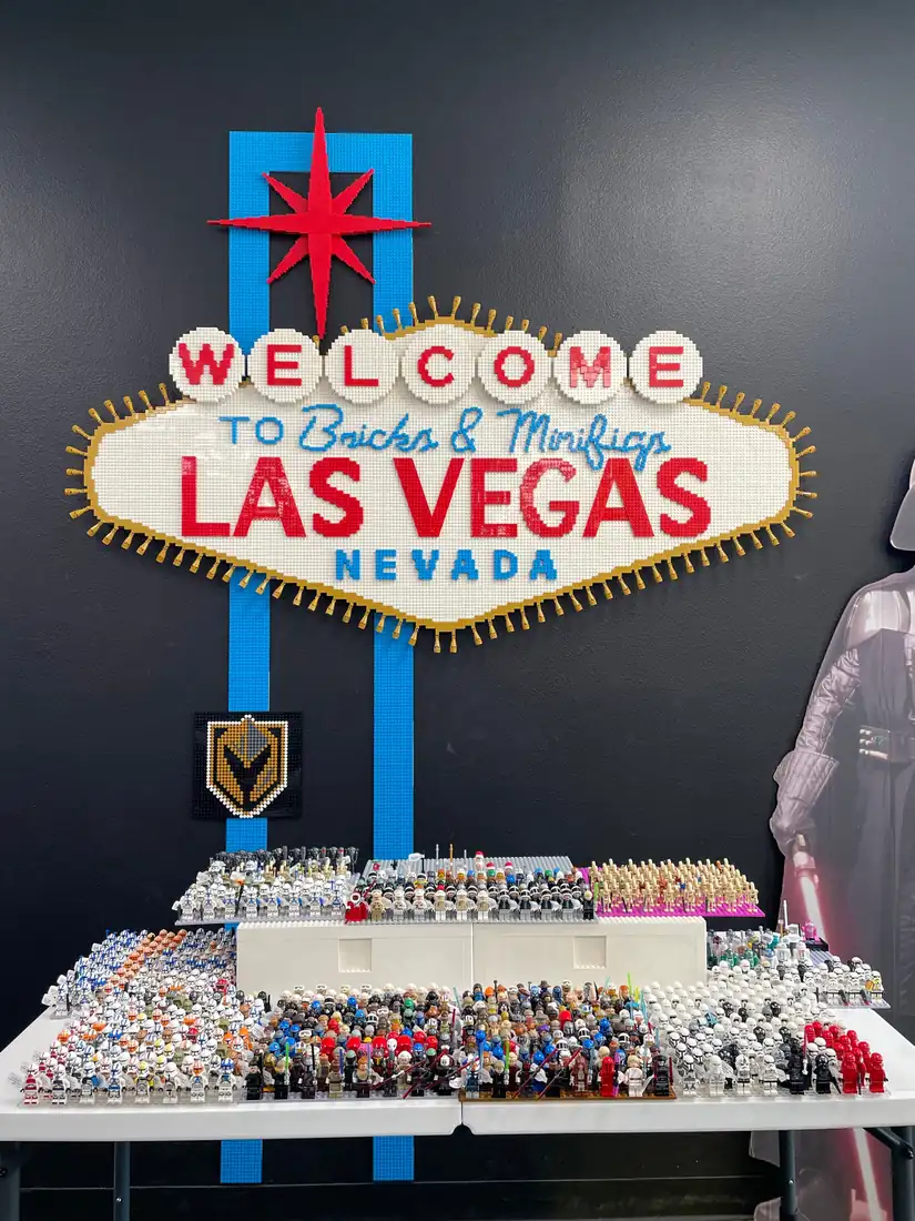 Rows of LEGO® Star Wars minifigures displayed beneath the Las Vegas store sign.